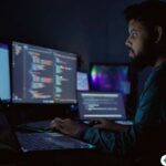 IT professional working on a secure cloud system at night with code overlays, illustrating how Citrix improves performance and eliminates RDP lag for hosting Accounting CS in CPA firms.