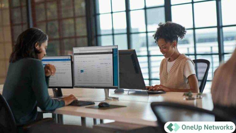 Accounting professionals working on desktop computers in a modern office environment representing scalable cloud technology for CPA firms