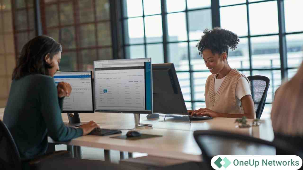 Accounting professionals working on desktop computers in a modern office environment representing scalable cloud technology for CPA firms