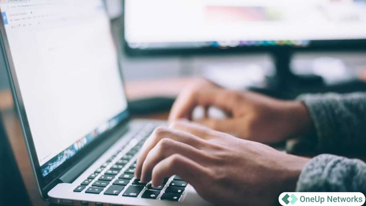 Professional using a laptop to access cloud-based accounting systems while scaling accounting firm technology