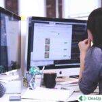 Accounting professional working at a desktop computer experiencing performance issues in a shared RDP environment.