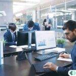 Accounting professionals working in a modern office using cloud remote desktop solutions, representing CPA firms transitioning from RDP to Citrix for reliable performance.