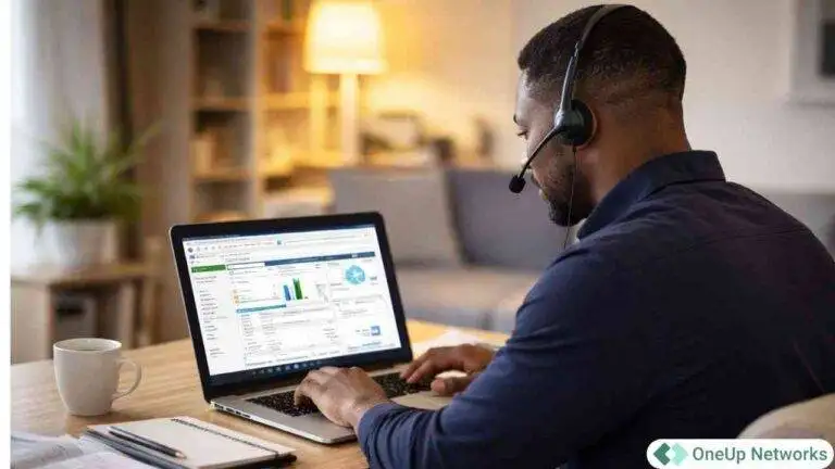 Accountant working on QuickBooks Enterprise in a modern office with OneUp Networks logo displayed
