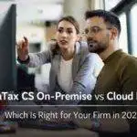 Two accounting professionals reviewing data on desktop monitor representing UltraTax CS on-premise vs cloud hosting comparison