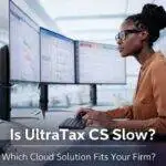 Professional working on dual monitors with Is UltraTax CS Slow and cloud hosting performance title overlay in modern office
