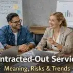 Contracted-out services business team discussing outsourcing strategy with charts and laptops in a modern office