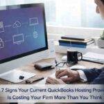 Business professional working on desktop with cloud network diagram in office