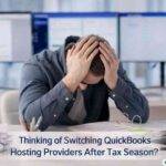 Accountant reviewing tax documents and calculator on desk after tax season work