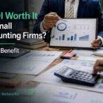 Accounting professionals discussing VDI cost and benefit analysis with financial reports and charts.